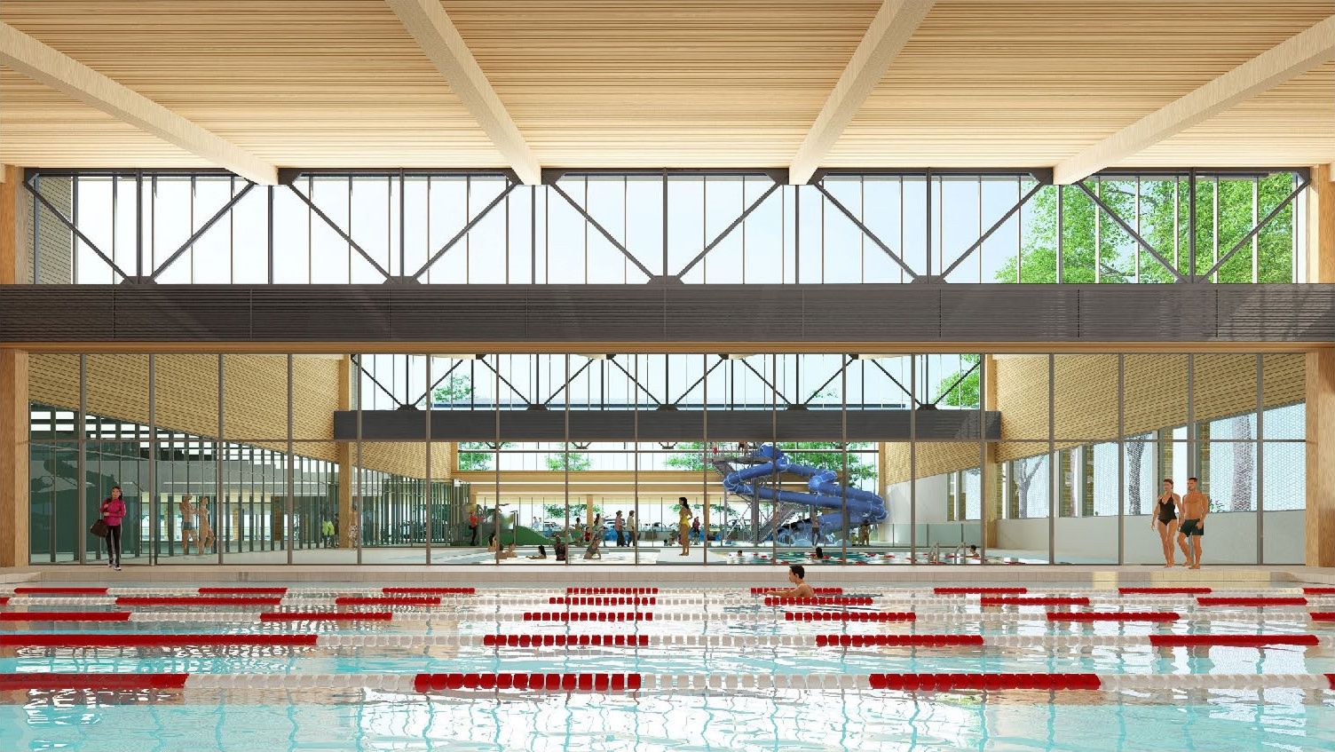Interior view of a modern indoor aquatics facility with a swimming pool, lanes, a blue water slide, and people swimming and