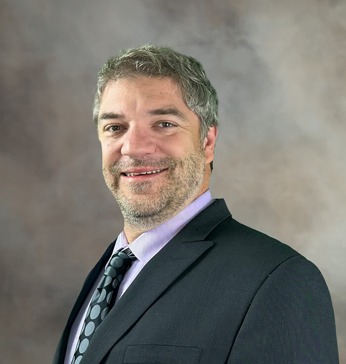 Jake Worley Hood, Commissioner, wearing a suit and tie.