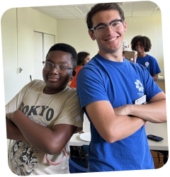 Two participants smiling and posing together during a Park District youth program.
