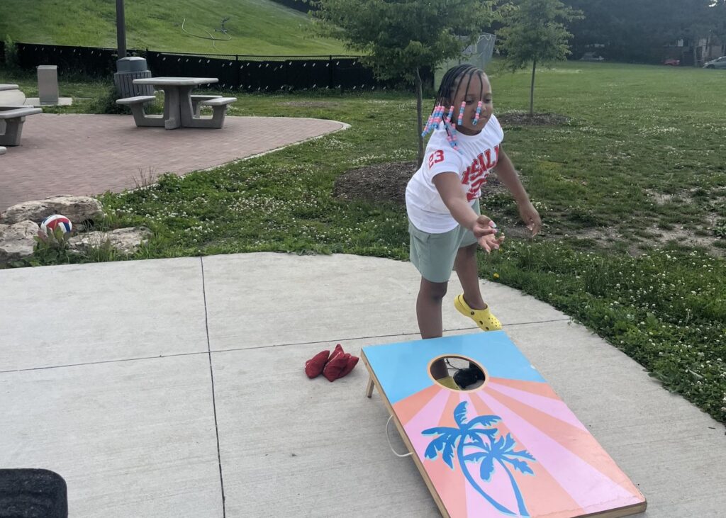 a girl plays bags