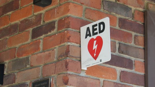aed sign on a brick building