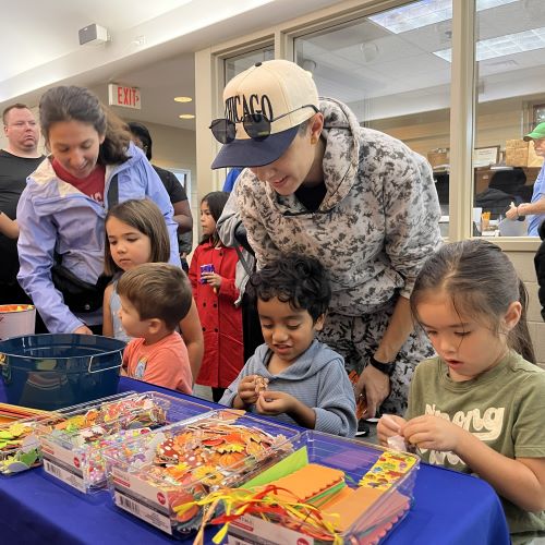 kids and parents make bookmark crafts at fall fest