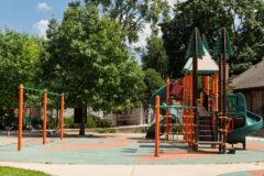 orange and green nature-themed playground equipment
